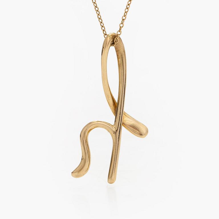 Tiffany & Co, Elsa Peretti, an 18K gold 'Alphabet Pendant' necklace.