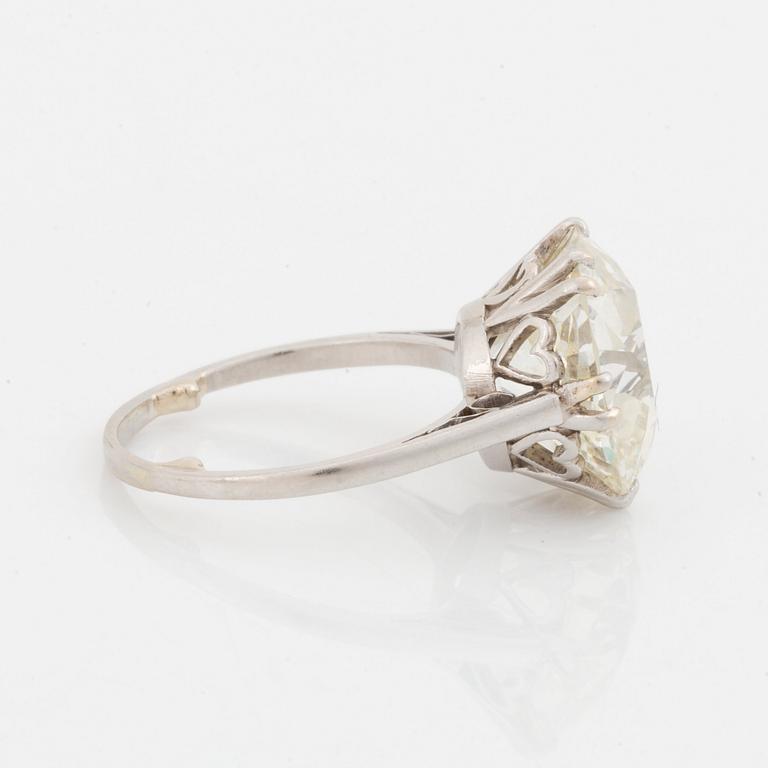 A platinum ring set with a cushion-formed old-cut diamond.