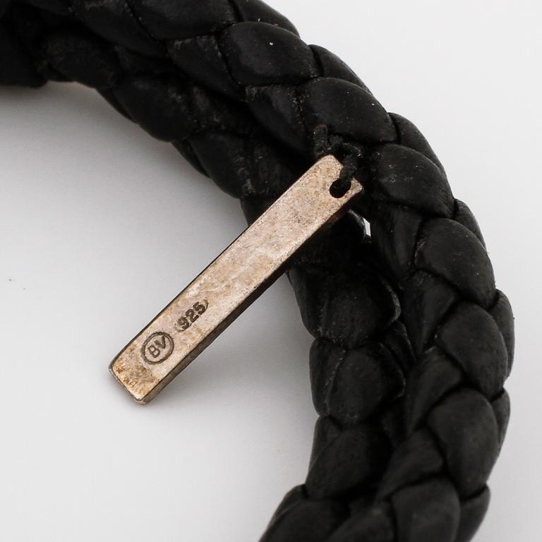 A bracelet by Bottega Veneta.