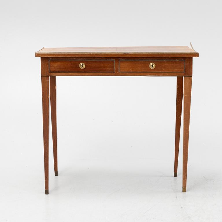 A late Gustavian style mahogany table with drawers.