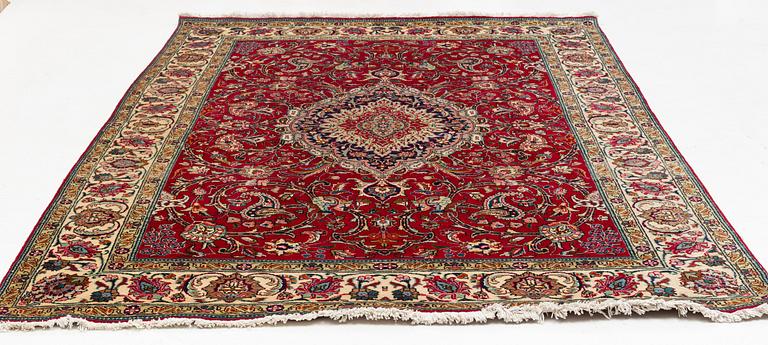 A Tabriz Carpet, circa 316 x 220 cm.