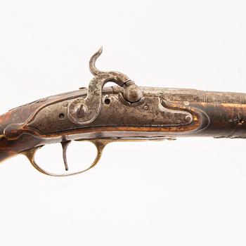 An 18th Century converted percussion pistol.