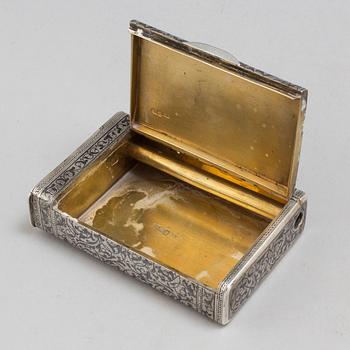 A parcel gilt silver case with niello, assaymaster Anatolij Artsybashev, Moscow 1889.