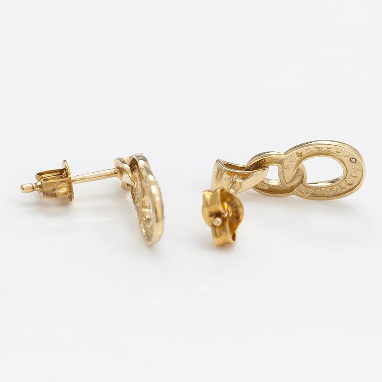 A pair of 14K gold earrings with diamonds ca. 0.01 ct in total.
