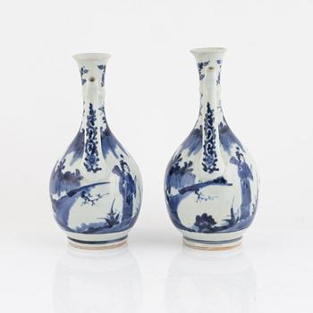 A pair of Japenese blue and white ewers, probably Meiji (1868-1912).