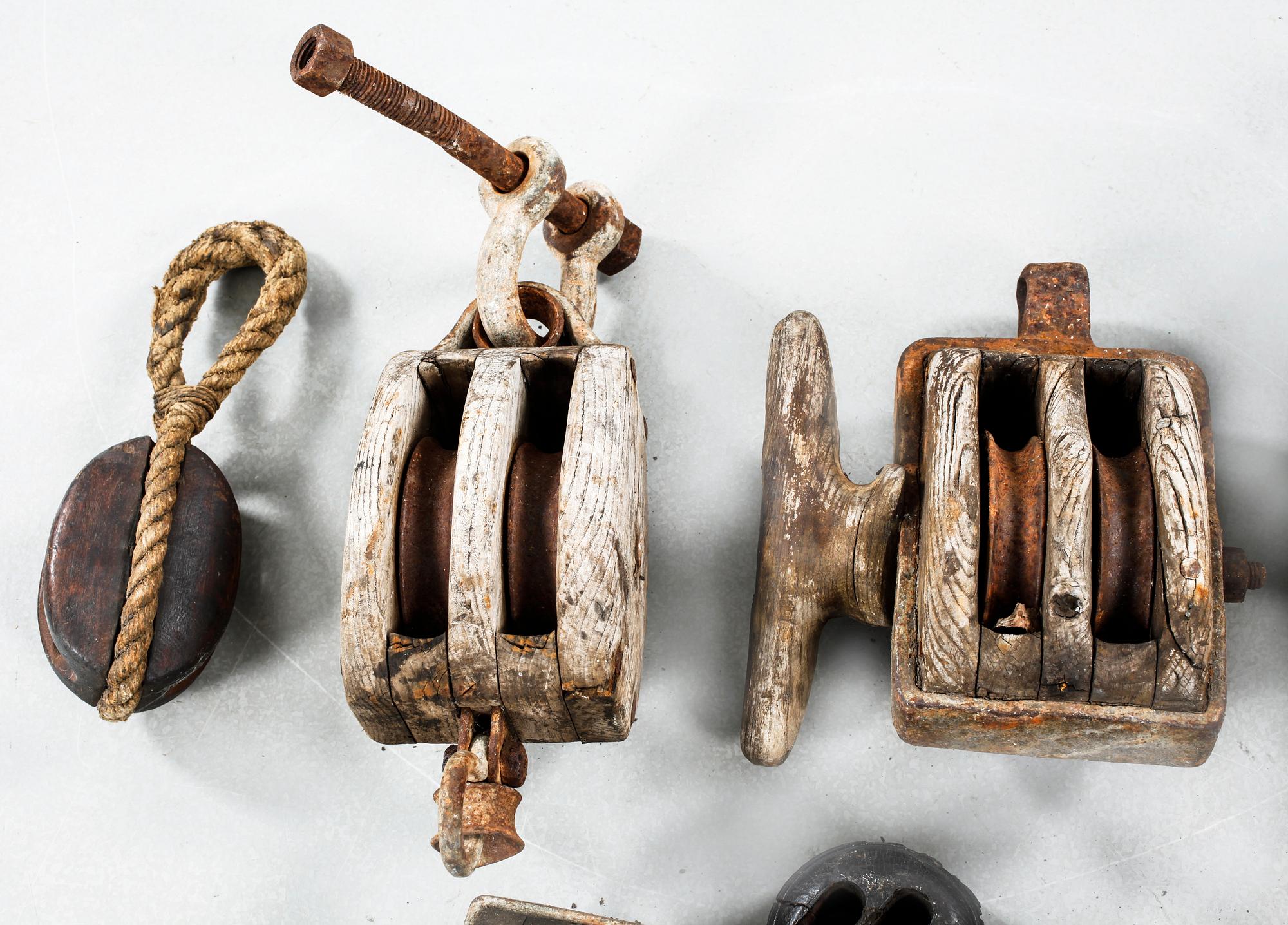 Seven pullies from the first half of the 20th century.