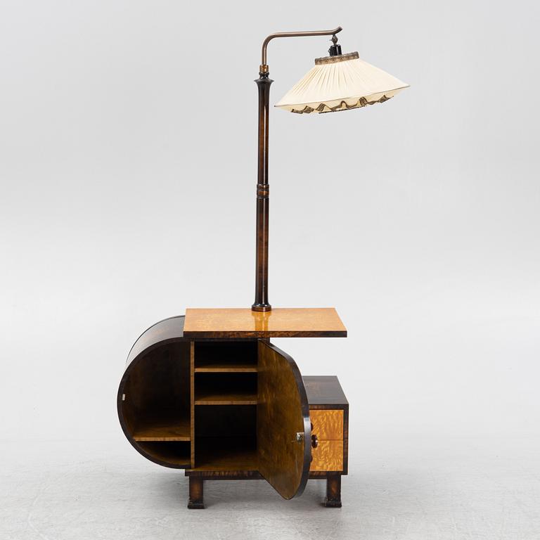 A 1930s sidetable with a lamp.