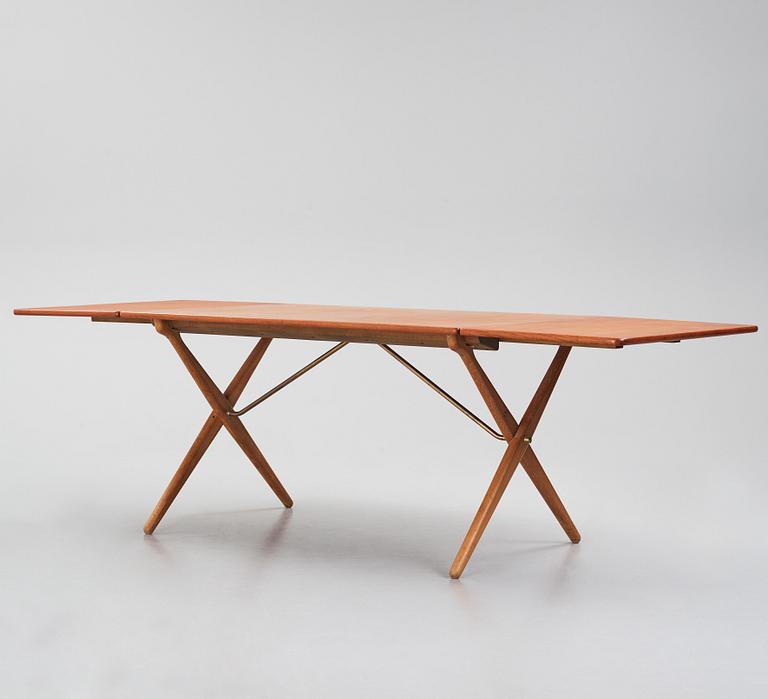 Hans J. Wegner, a teak and oak drop-leaf dining table, Andreas Tuck, Denmark 1950s-1960s.