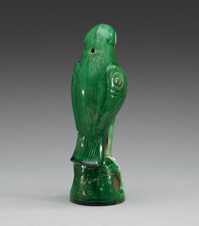 A green glazed figure of a falcon, Qing dynasty.