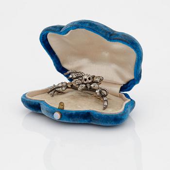A BROOCH set with old-cut diamonds.