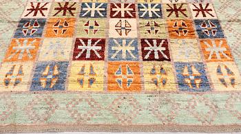 A Moroccan design carpet, c. 299 x 198 cm.