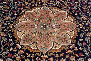A carpet, Tabriz, signed Ipchilar, ca 385 x 280 cm.