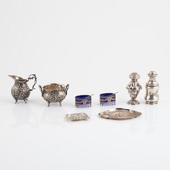 Nine pieces of silver and a silver plate coaster, England, Austria and Sweden.