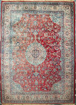 A carpet from Turkey. Circa 383x277 cm.