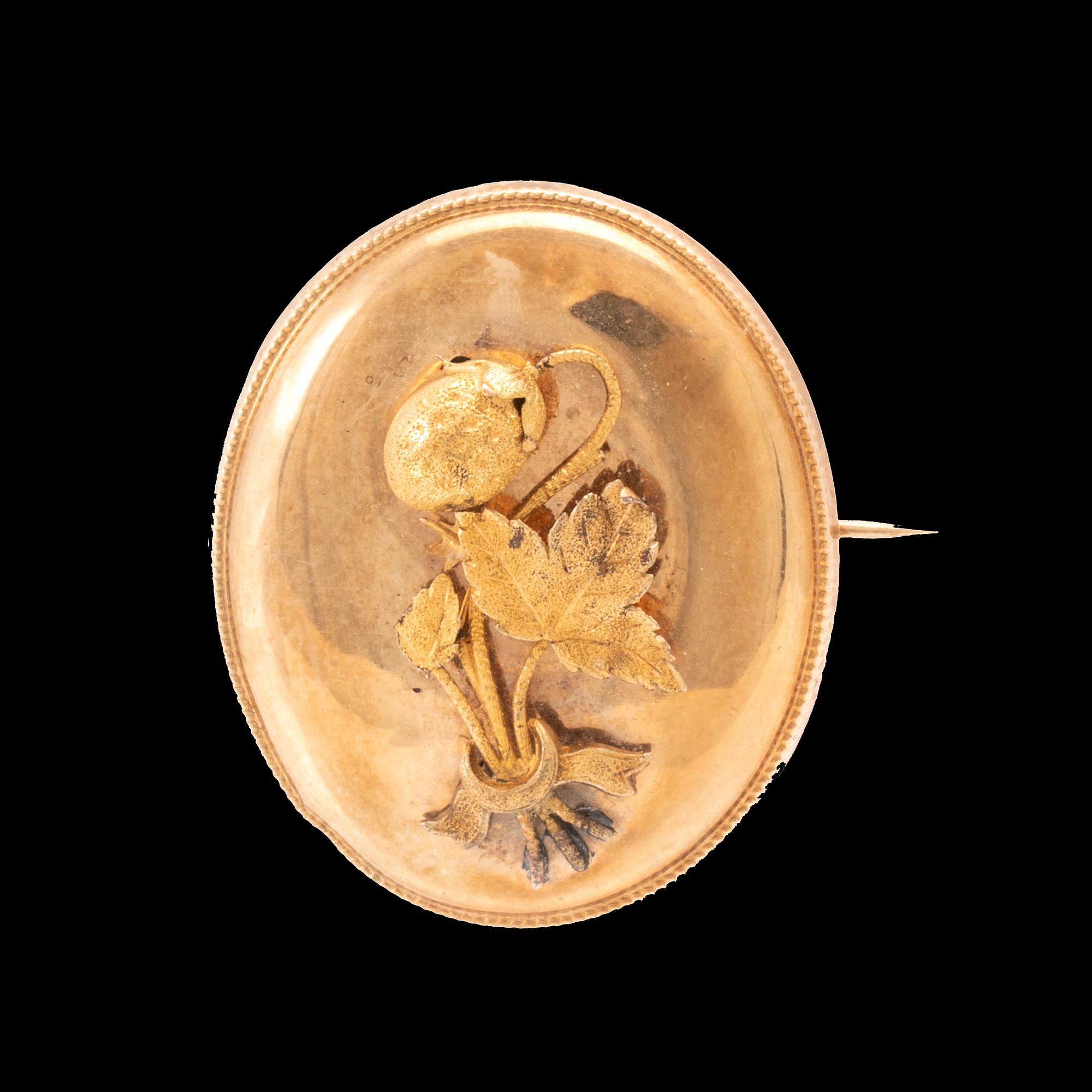 A 14K gold brooch.
