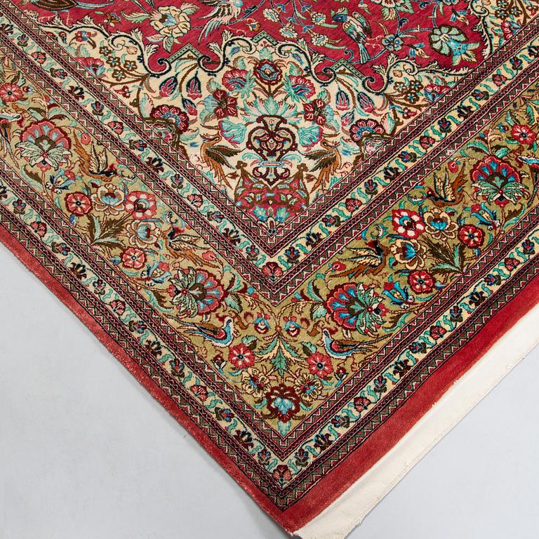 A silk Qum rug, central Persia, approx. 232 x 137 cm.