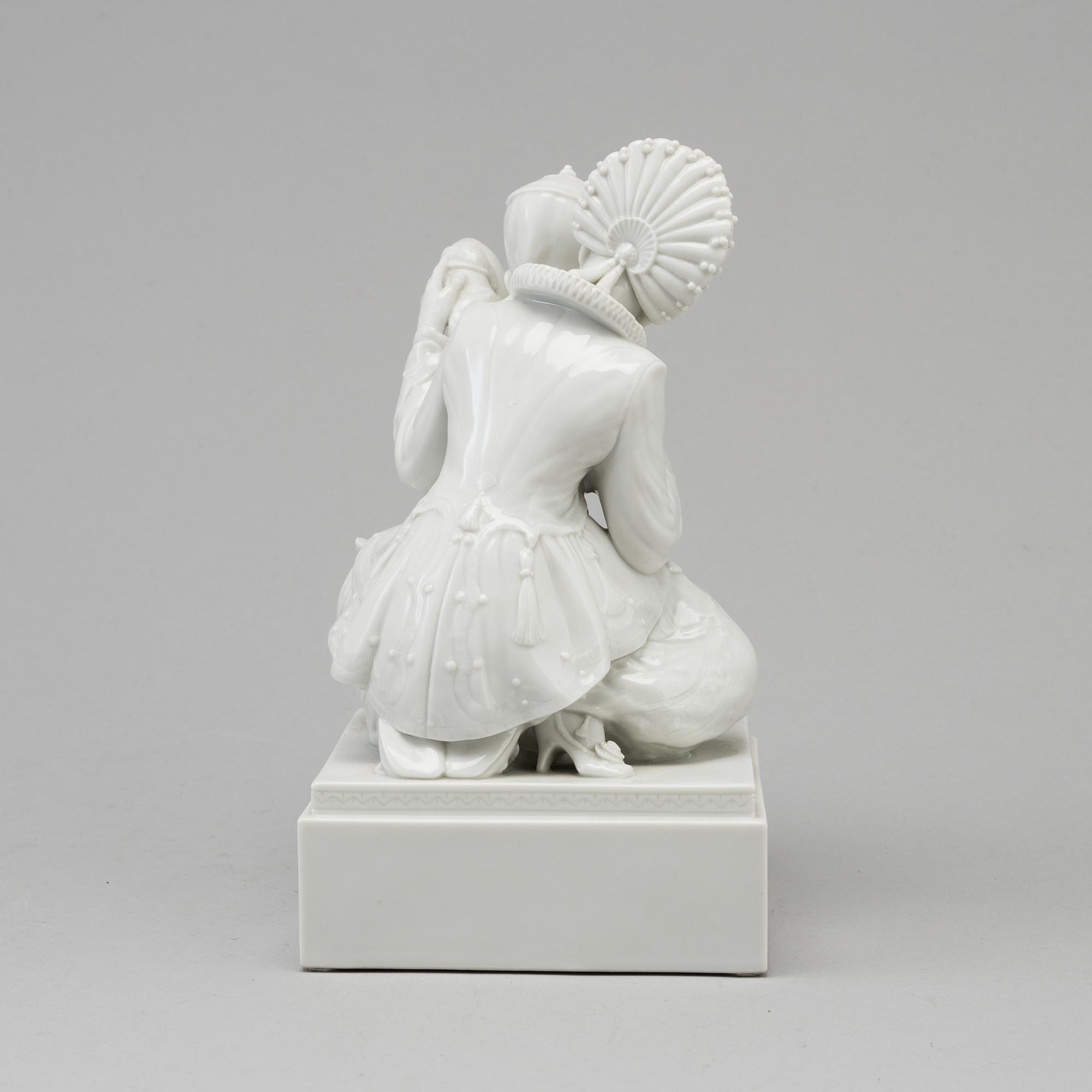 A white glazed Royal Copenhagen porcelain figure, Gerhard Henning, Danmark, 1920's.