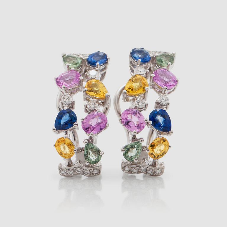 A pair of sapphire and diamond earrings. Total carat weight of sapphires 4.26 cts and diamonds 0.38 ct.