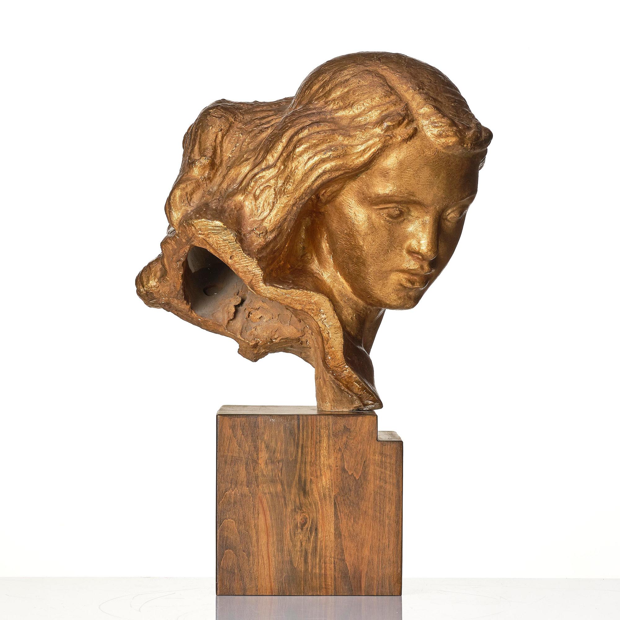 John Lundqvist, a gilt plaster sculpture of a young woman's head, dated 1933.