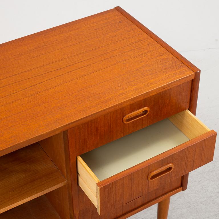 A 1950's teak veneered sideboard.