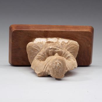 A stucco figure of a seated buddha, Gandhara, 2nd/3rd Century.