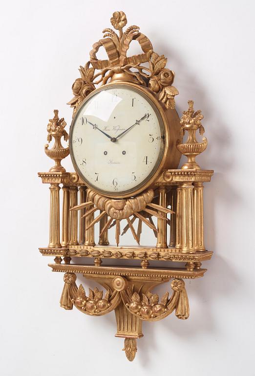 A Gustavian giltwood cartel clock by H. Wessman (watchmaker in Stockholm 1787-1805).