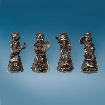 A set of four silver figure shaped buttons, Qing dynasty.