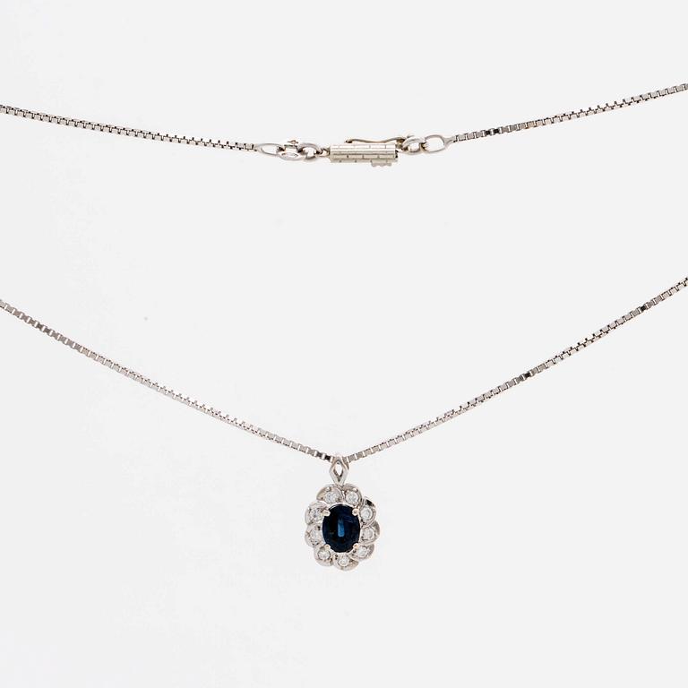 HÄNGE med kedja 18K vitguld 1 safir ca 6 x 4 mm samt 9 briljanter ca 0,25 ct totalt.