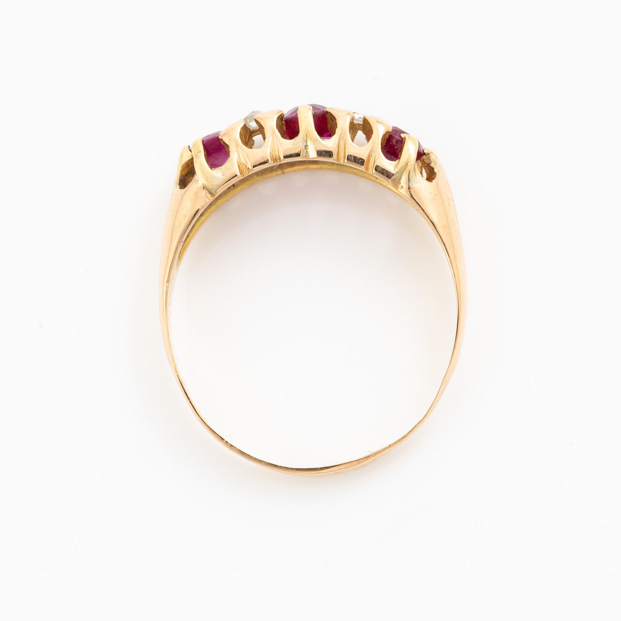 A ring 18K gold with rose-cut diamonds and red stones.