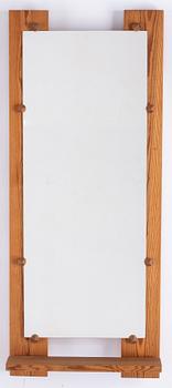 A pine mirror by Gunar Kanevad, signed and dated 1971.