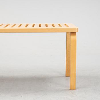 A bench and a stool by Alvar Aalto, from around the year 2000.