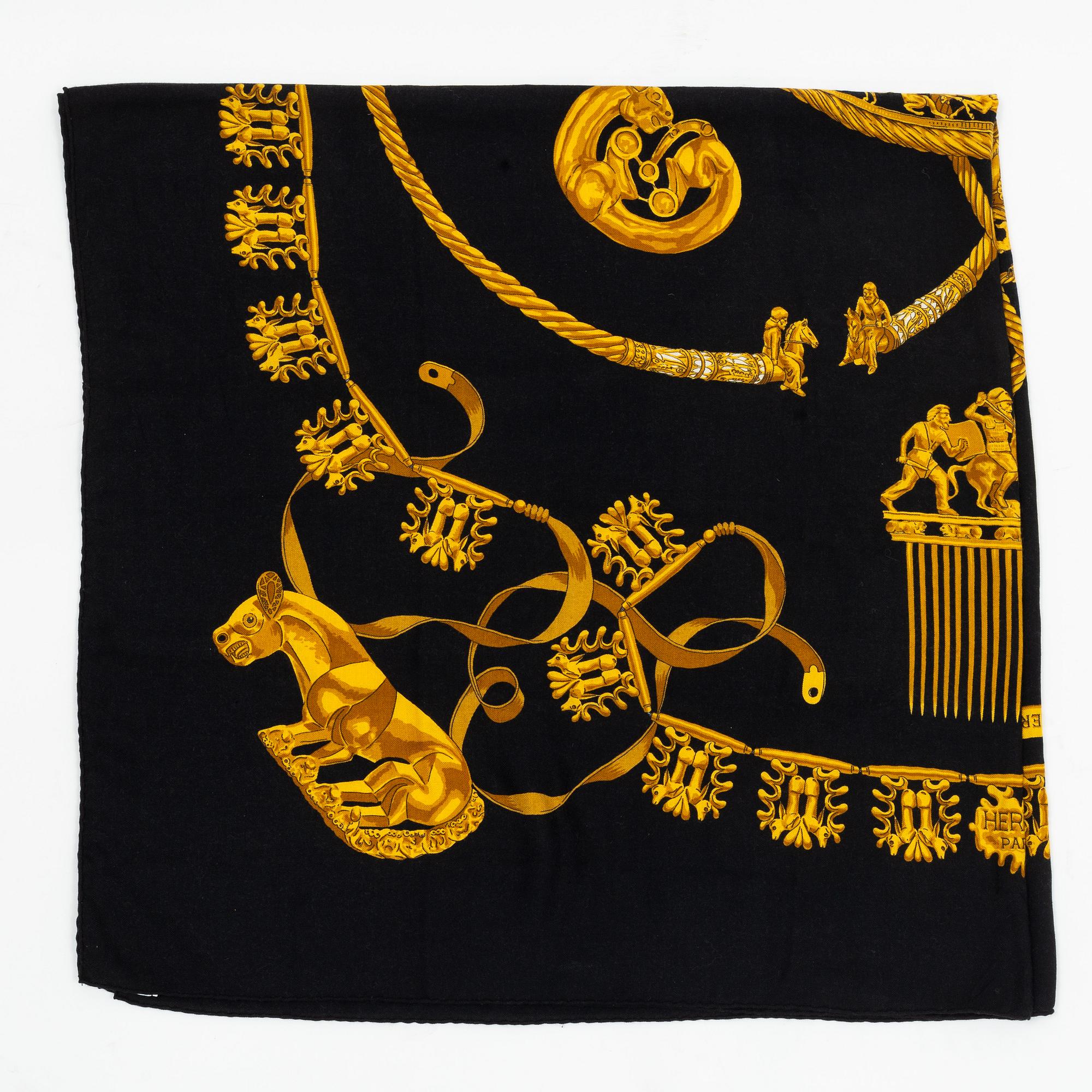 Hermès, a 'Les Cavaliers d'Or' cashmere and silk shawl.