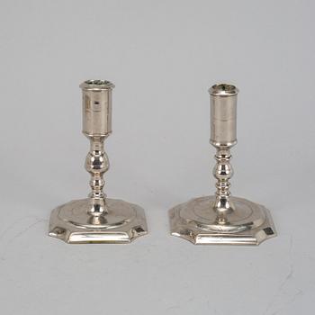Two Swedish 18th century candlesticks.