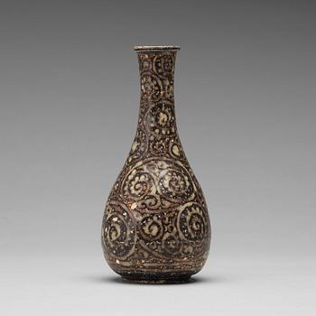 A black glazed sgrafitto vase, presumably Song dynasty (960-1279).