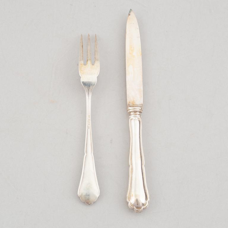 A set of 24 silver fruit knives and forks by Hanna Persson, Kristianstad, Sweden, 1923.