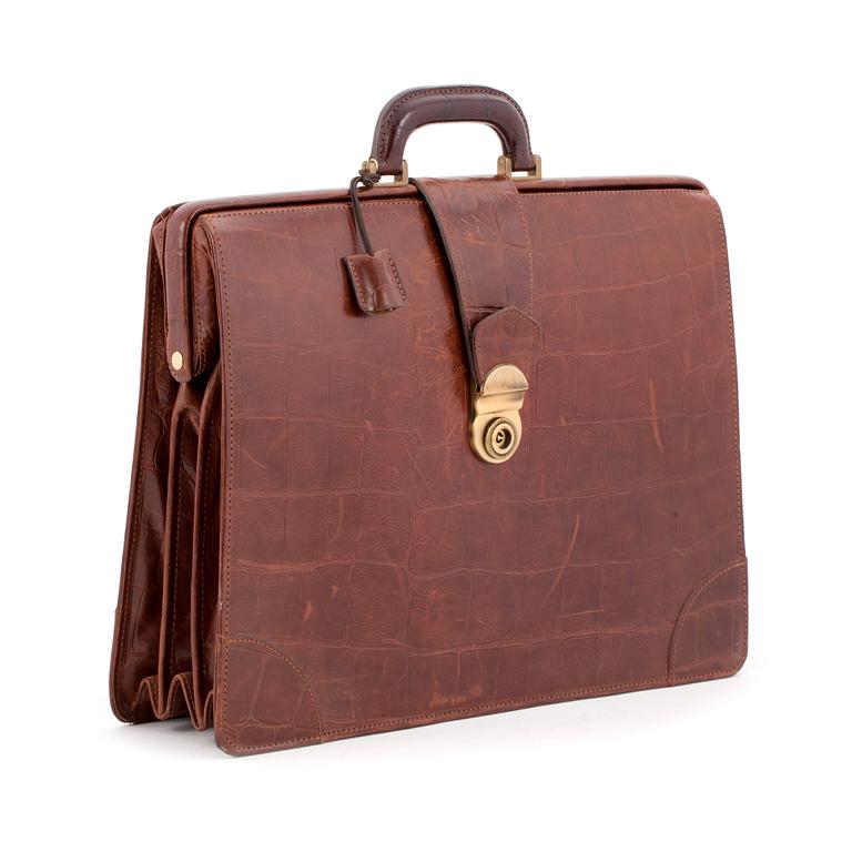 MULBERRY, a brown leather embossed briefcase.
