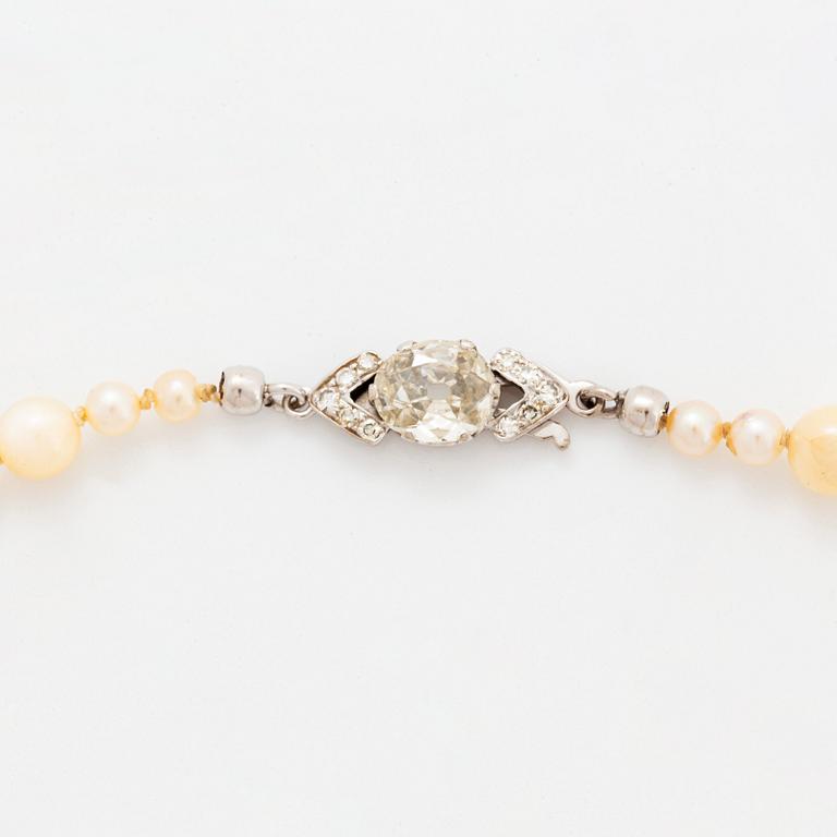 A cultured pearl necklace with a WA Bolin clasp.