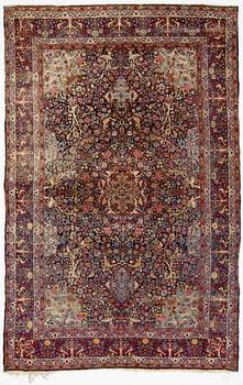 A carpet, Antique/semi-antique Kerman, ca 340 x 220 cm.