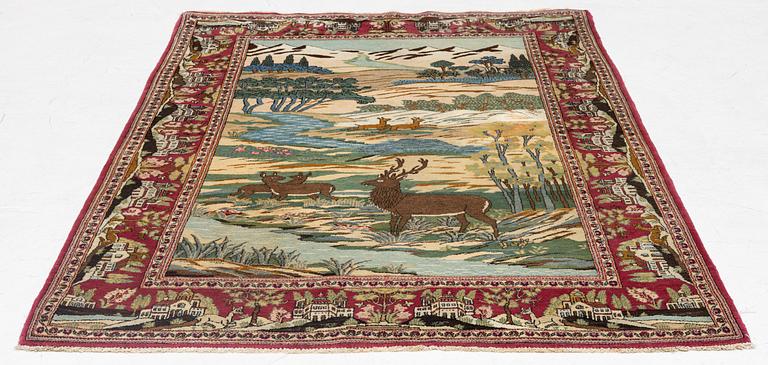 A pictoral semi-antique Keshan rug, c 210 x 128 cm.