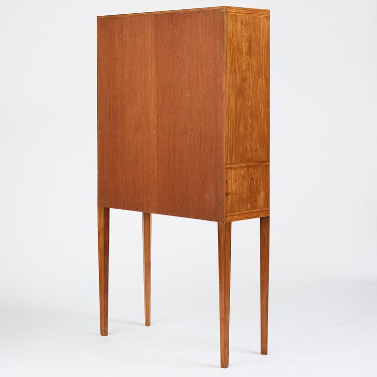 Carl Malmsten, a Swedish Modern cabinet on stand, a journeyman's masterpiece by Sven-Erik Fryklund, Sweden 1942.