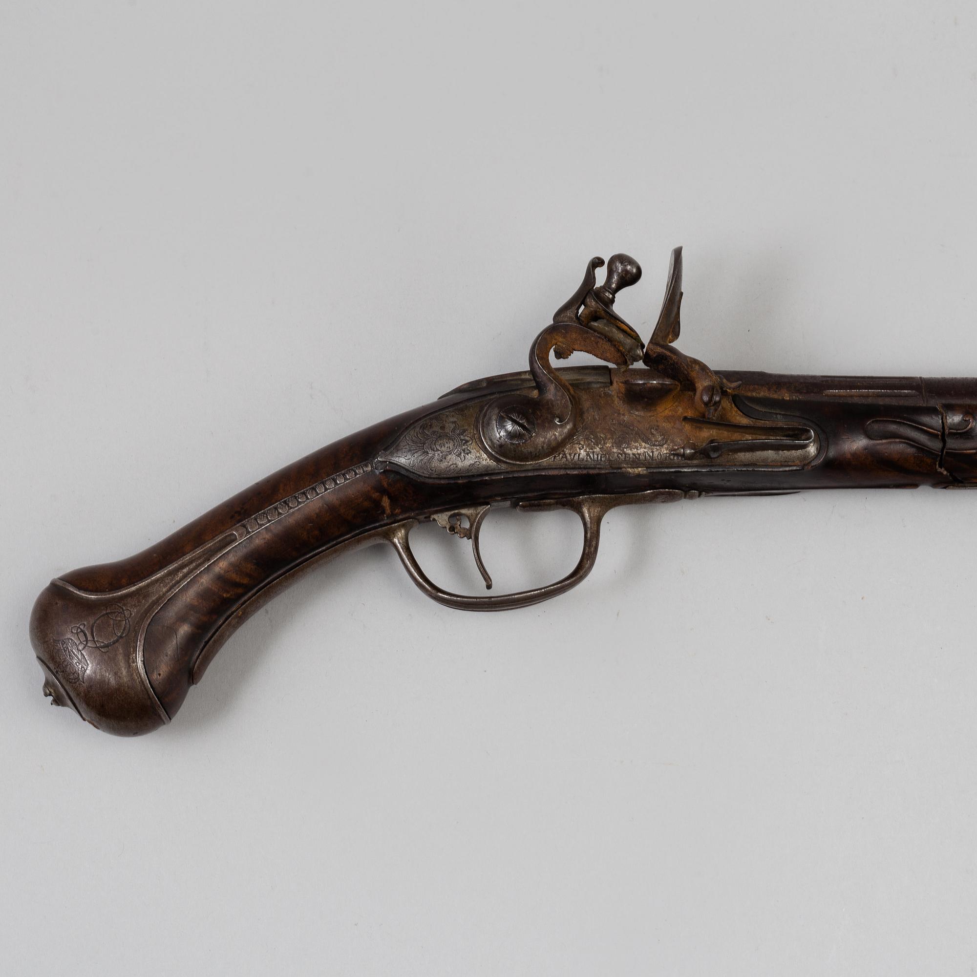 A Danish flint lock pistol signed, (Paul Nielsen Norrman, ca 1700).