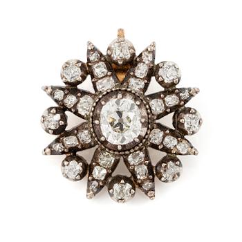 493. A pendant in silver and 14K gold set with old-cut diamonds.