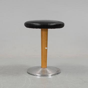 A mid 20th century stool with crome foot and leather coated seat.