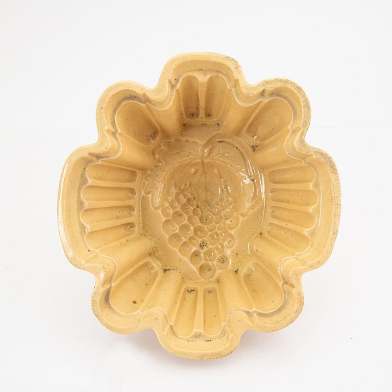 A set of five glazed earthenware moulds from Höganäs around 1900.