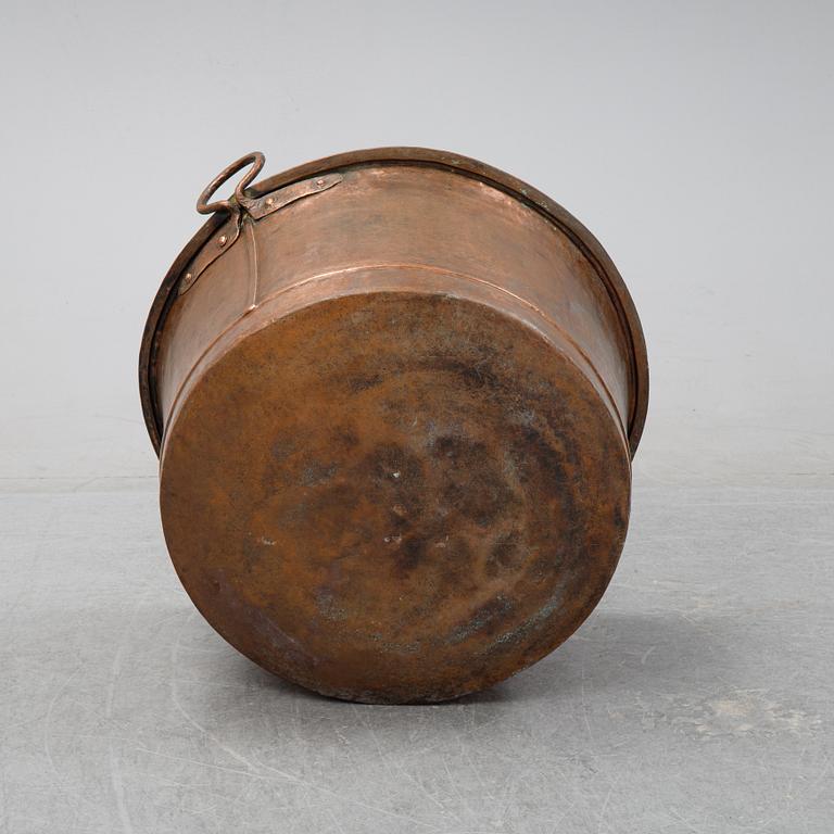 An 19th Century copper cauldron.