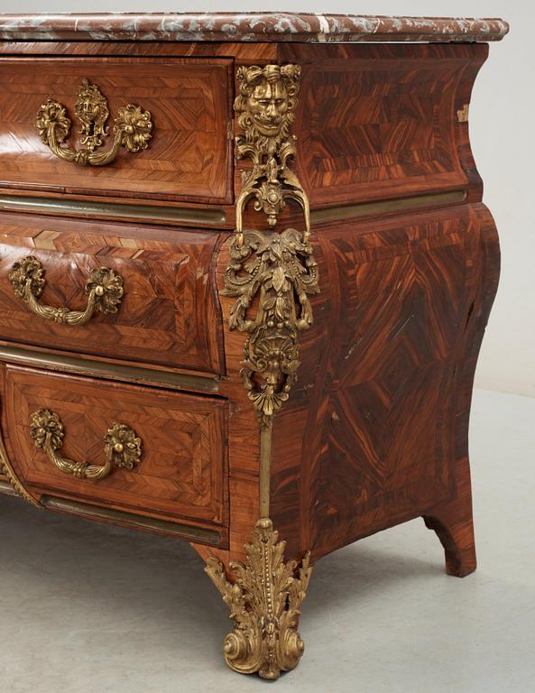 A French Régence 18th century commode in the manner of F. Mondon.