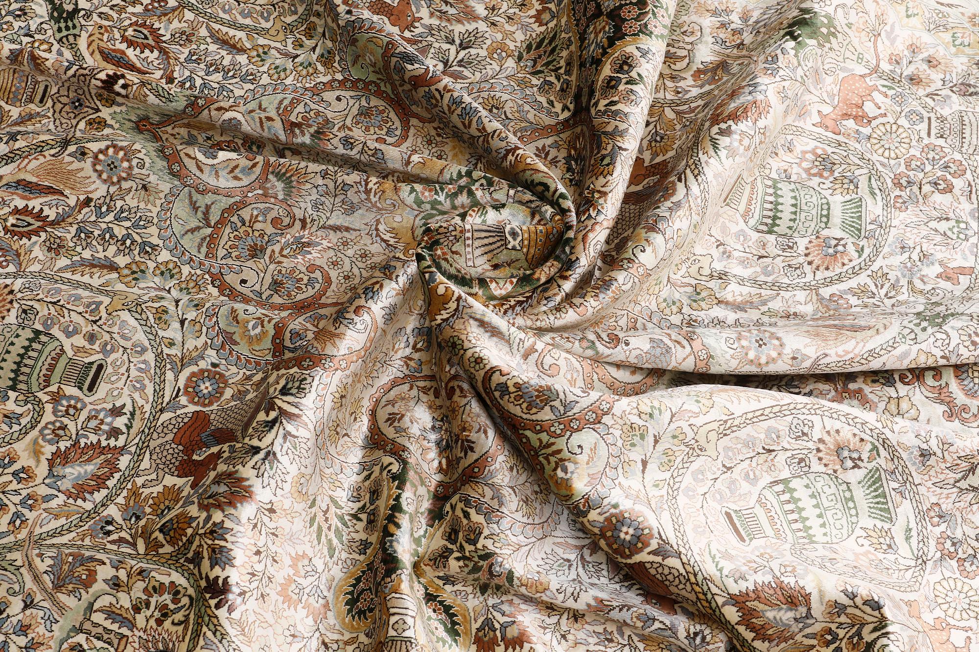 An oval pictoral silk carpet, ca 273 x 180 cm.