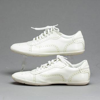 A pair of Louis Vuitton shoes.