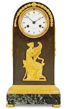 1079. A French Empire mantel clock by A. A. Ravrio.