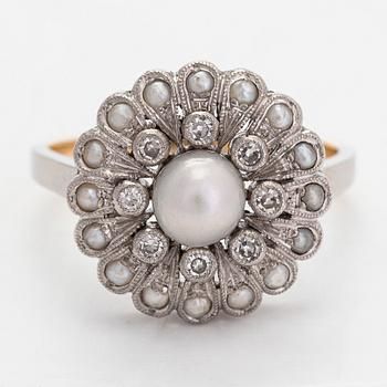 A platinum/18K gold flower ring, with cultured pearls, and eight-cut diamonds, A.Tillander.